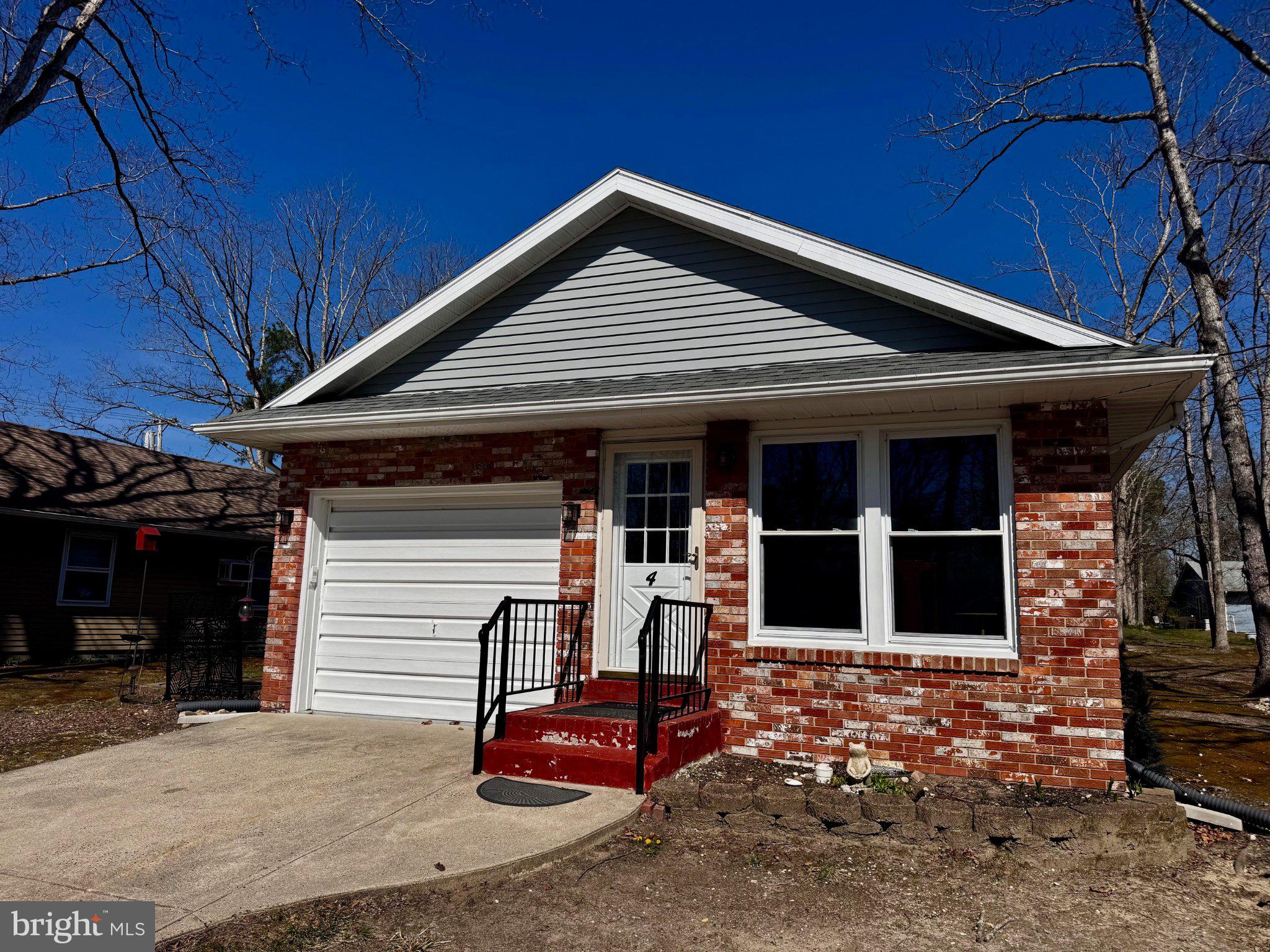 Charming brick home with inviting entrance.