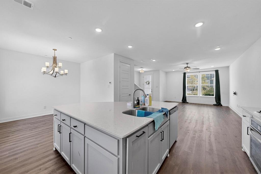 6629 Kort Street Rowlett, TX 75089 - Photo 39 of 39 a kitchen with a sink and wooden floor