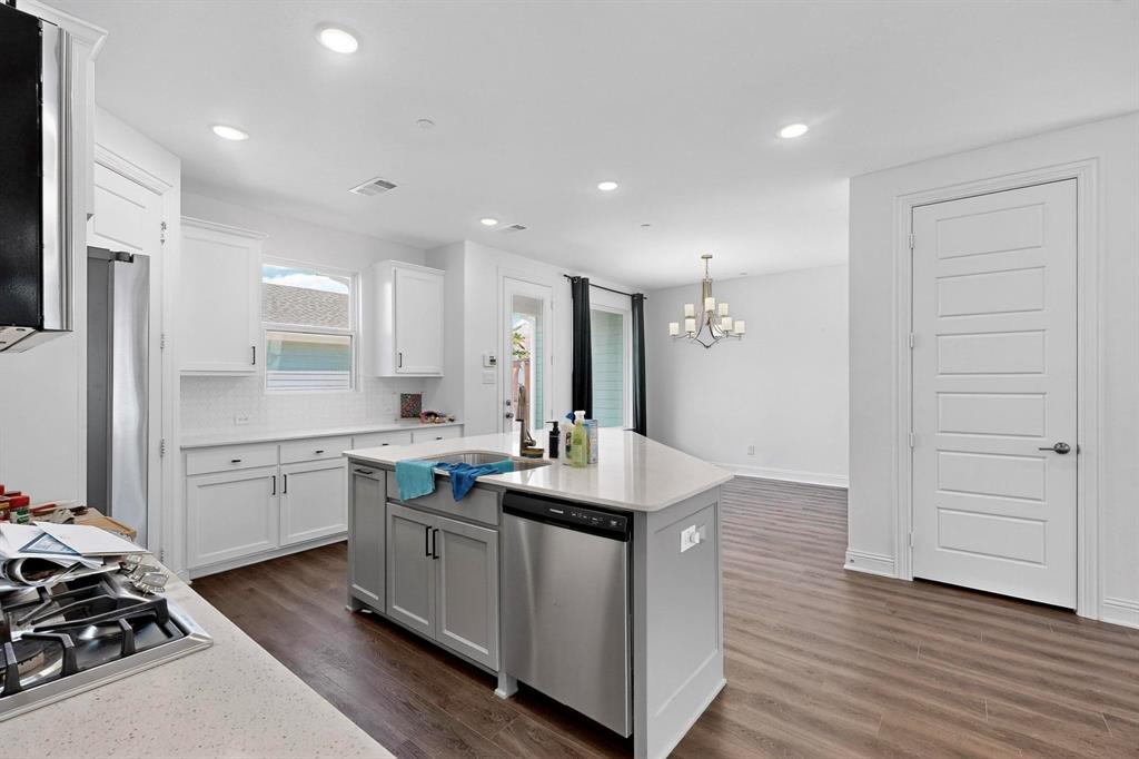 6629 Kort Street Rowlett, TX 75089 - Photo 11 of 39 a kitchen with a sink stove and cabinets