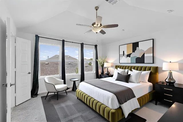 a kitchen with stainless steel appliances granite countertop a white cabinets a stove top oven and chandelier