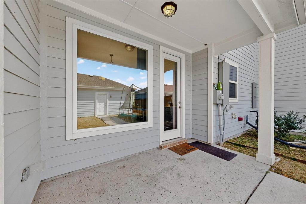 6629 Kort Street Rowlett, TX 75089 - Photo 33 of 39 a view of an entrance to house with yard
