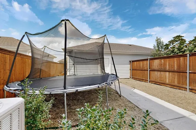 a view of an entrance to house with yard