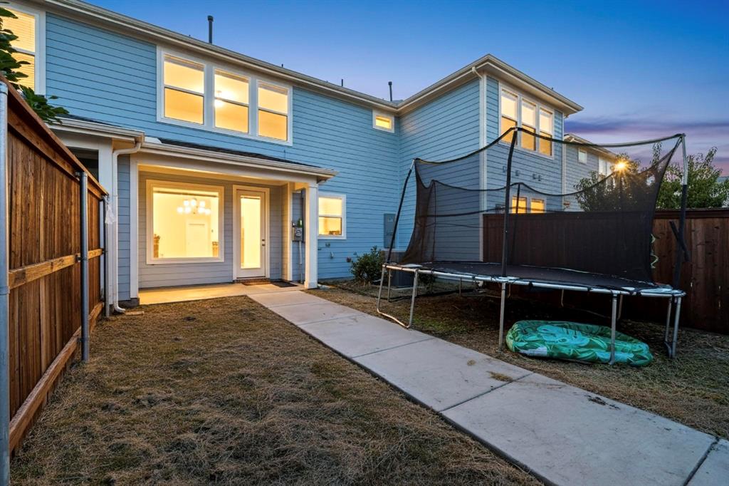 6629 Kort Street Rowlett, TX 75089 - Photo 36 of 39 a backyard of a house with barbeque oven table and chairs