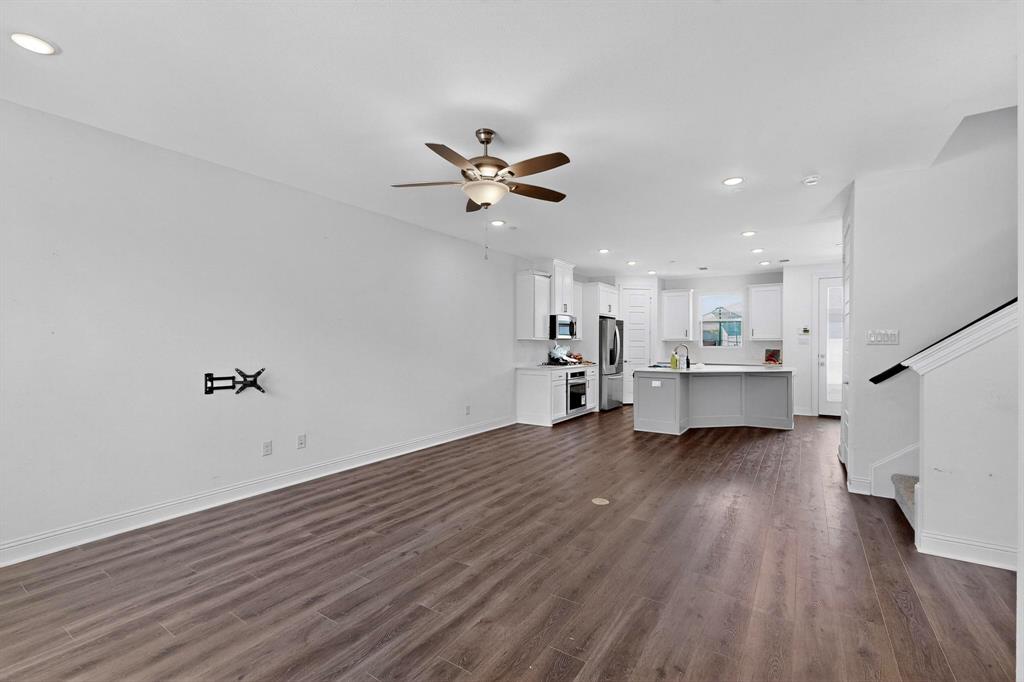 6629 Kort Street Rowlett, TX 75089 - Photo 6 of 39 a view of a kitchen with wooden floor and a kitchen