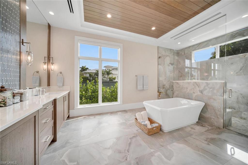 330 Broad Avenue North Naples, FL 34102 - Photo 18 of 49 Primary bathroom with to large custom design walk-in closet