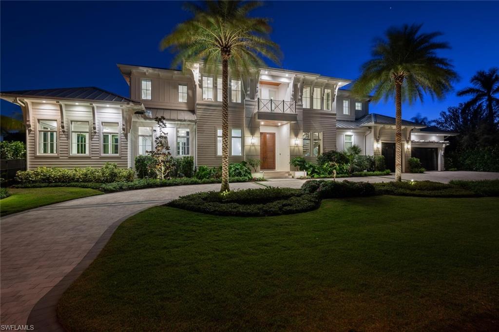 330 Broad Avenue North Naples, FL 34102 - Photo 3 of 49 Night elevation featuring landscape and canopy lighting