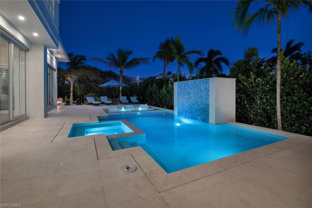 330 Broad Avenue North Naples, FL 34102 - Photo 42 of 49 Night photo pool and water feature