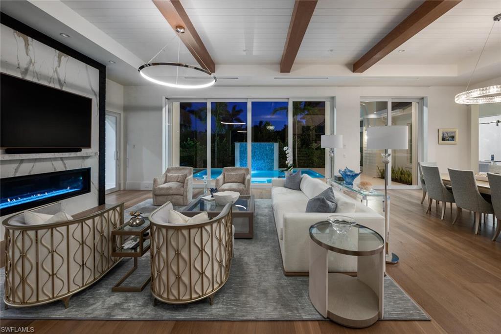 330 Broad Avenue North Naples, FL 34102 - Photo 5 of 49 Great room with view of evening water feature