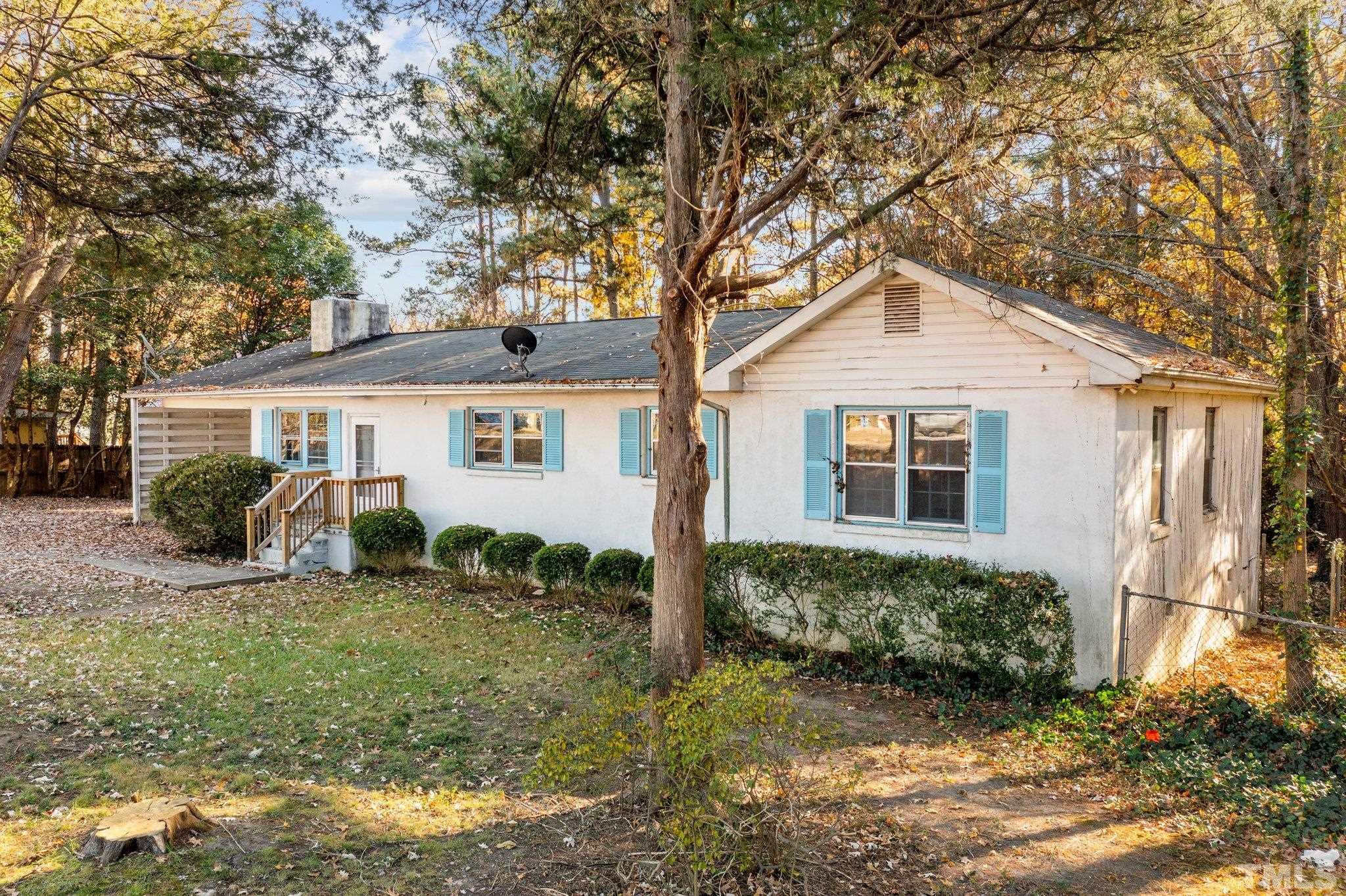 8104 Falls Of Neuse Road Raleigh, NC 27615 - Photo 1 of 15 front view of a house with a yard
