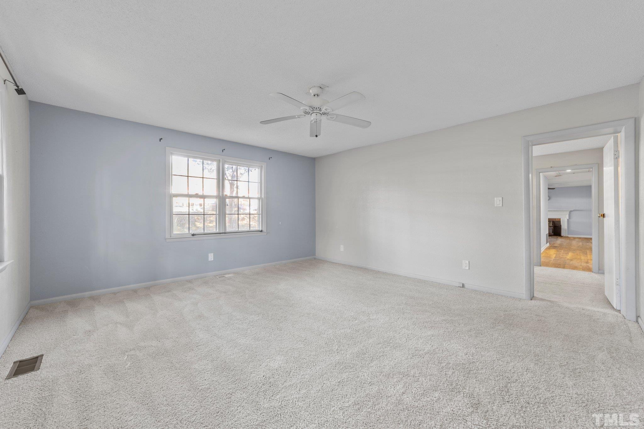 8104 Falls Of Neuse Road Raleigh, NC 27615 - Photo 12 of 15 a view of an empty room with a window