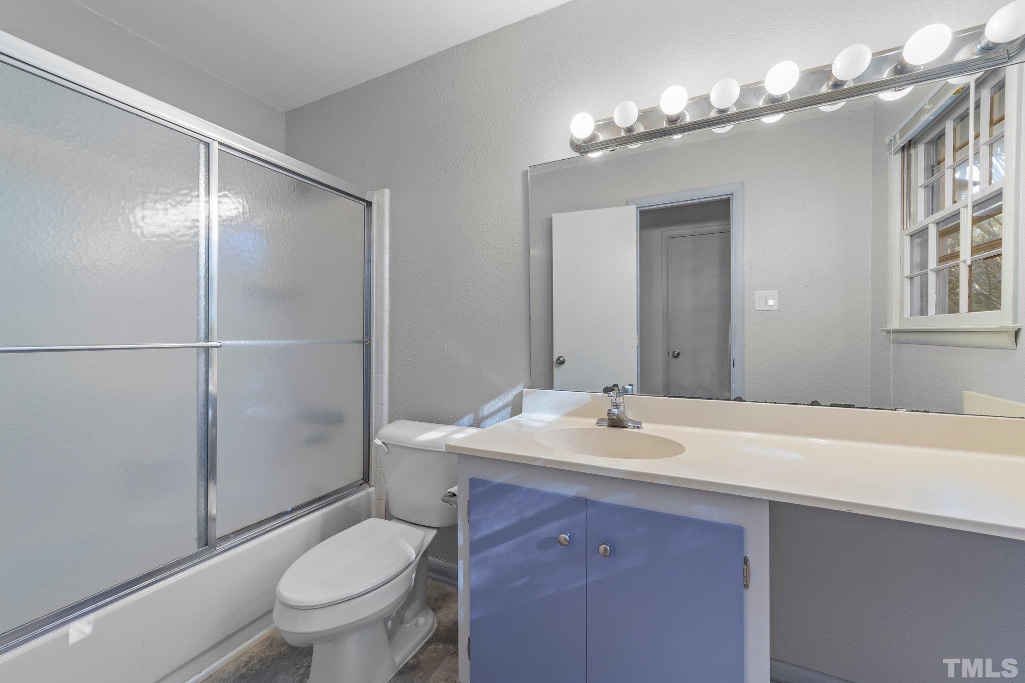 8104 Falls Of Neuse Road Raleigh, NC 27615 - Photo 14 of 15 a bathroom with a sink toilet and shower