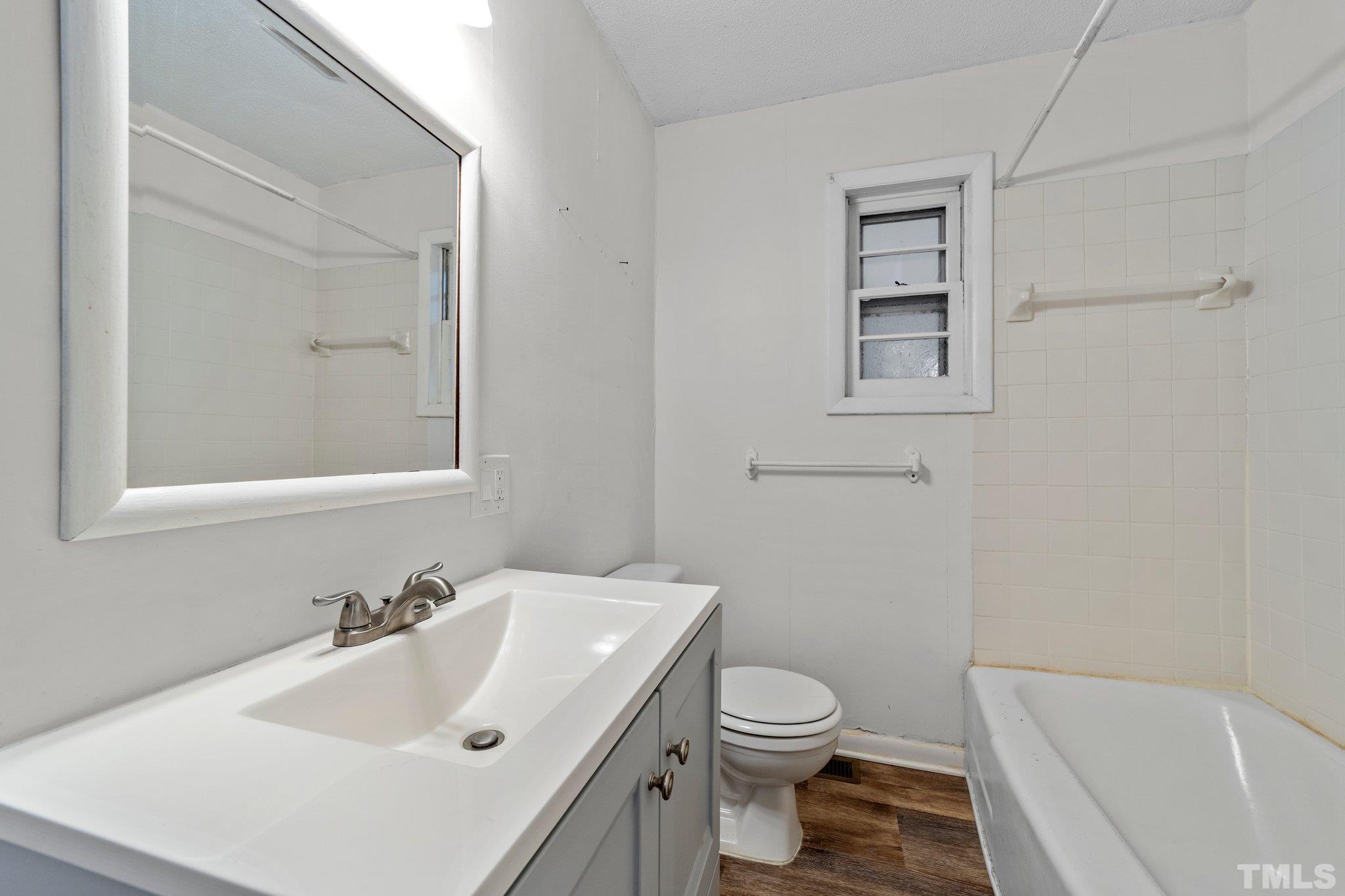 8104 Falls Of Neuse Road Raleigh, NC 27615 - Photo 15 of 15 a bathroom with a sink toilet and vanity