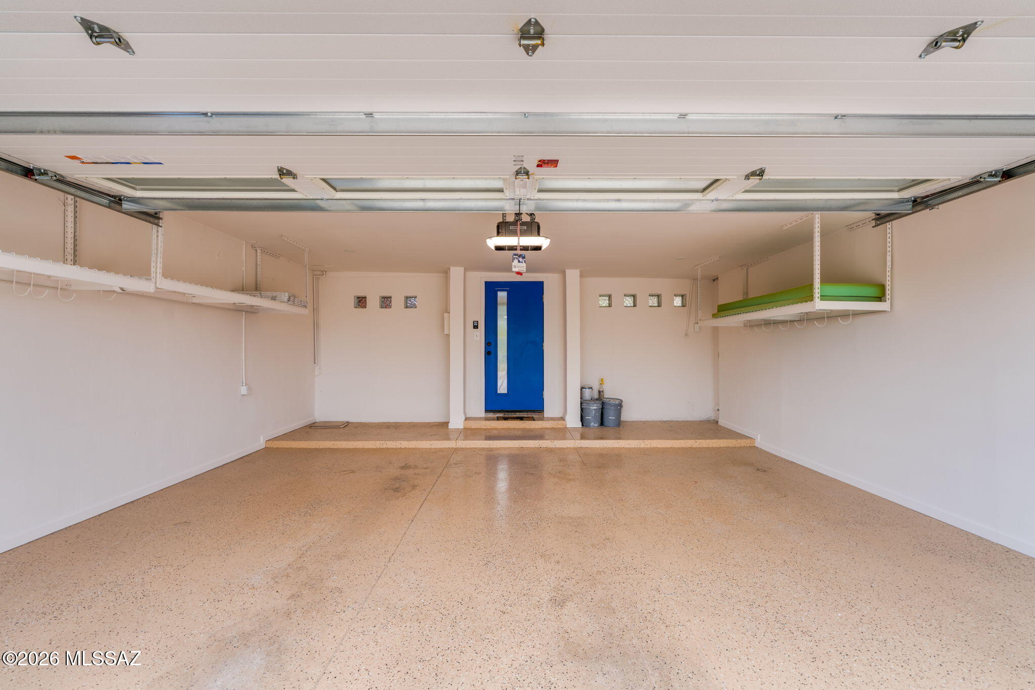 4425 North Pontatoc Road Tucson, AZ 85718 - Photo 43 of 47 Two car garage with shelving and room for sorage