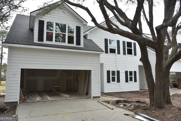a front view of a house with a yard