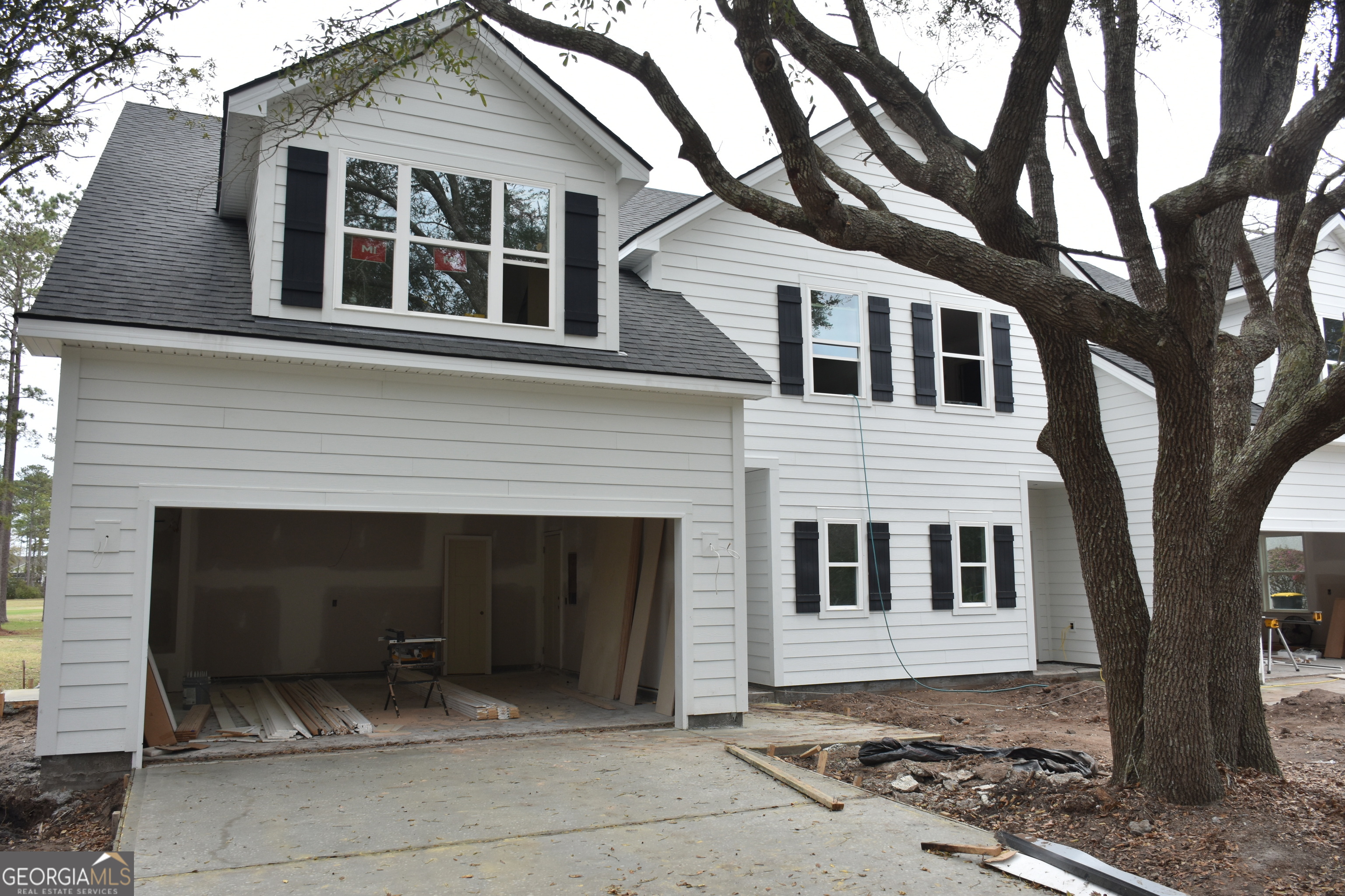 1151 Mayflower Road Northeast Townsend, GA 31331 - Photo 2 of 5 a front view of a house with a yard