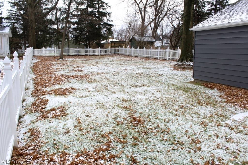5192 Edenhurst Road Cleveland, OH 44124 - Photo 26 of 32 The back is surrounded with a nice vinyl fence and has a gate located near the driveway and garage