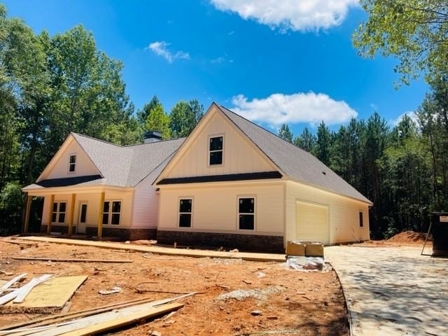 6330 West Dixie Highway Rutledge, GA 30663 - Photo 1 of 1 a view of a white house with a yard