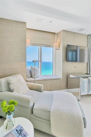 a en suite bathroom with a sink a mirror and a bathtub