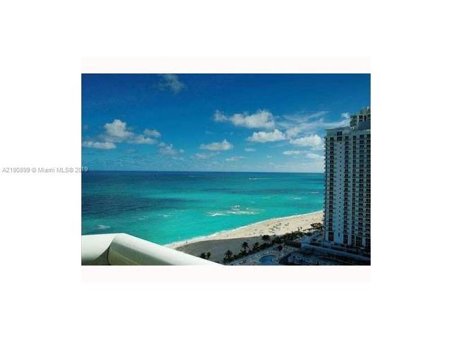 a kitchen with stainless steel appliances a table and chairs