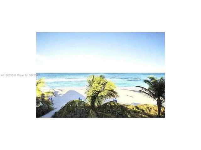 a kitchen with a sink a counter top space and stainless steel appliances