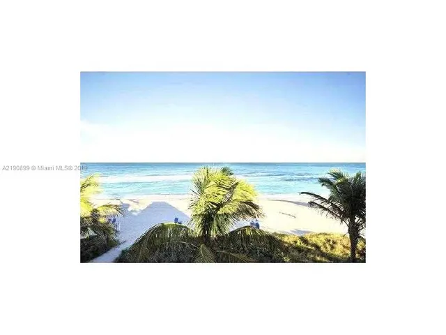 a kitchen with a sink a counter top space and stainless steel appliances