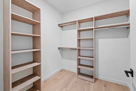 a view of an empty walk in closet