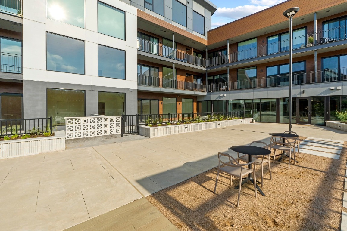 2209 South 1st Street, Unit 122 Austin, TX 78704 - Photo 31 of 40 a swimming pool view with a outdoor seating