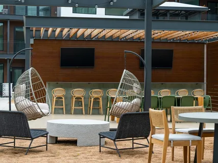 a outdoor living area with furniture and a rug