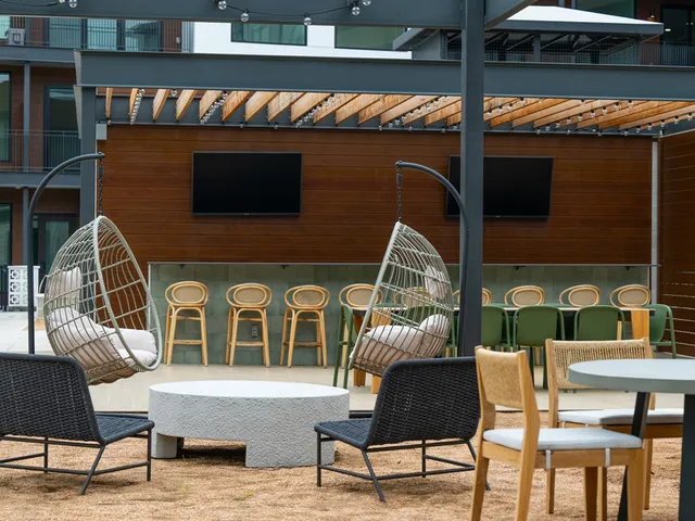 a outdoor living area with furniture and a rug