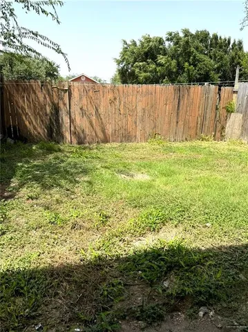 a view of a kitchen with a sink and cabinet