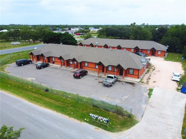 an aerial view of a house with outdoor space