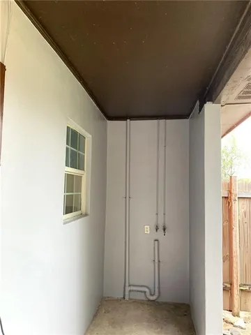 a view of empty room with windows