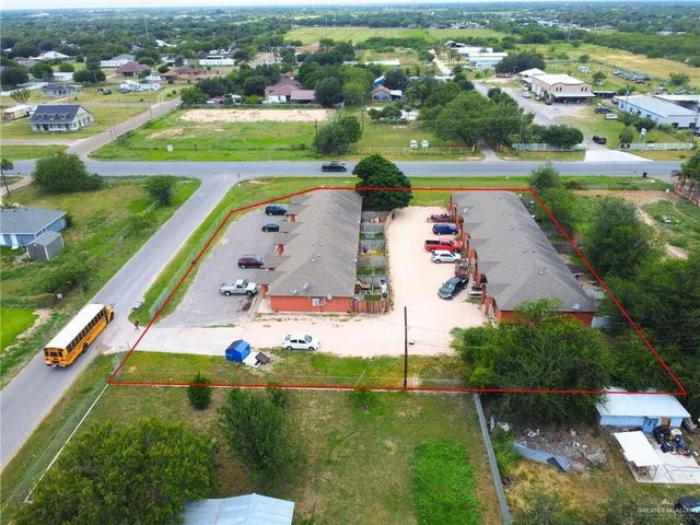 a kitchen with cabinets appliances and a window