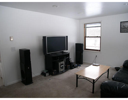 11 Clement Road Townsend, MA 01469 - Photo 4 of 8 a living room with furniture and a flat screen tv