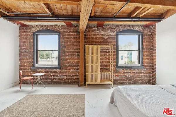 a front view of a house with a large window