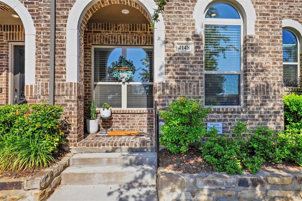 4148 Riverside Drive Flower Mound, TX 75028 - Photo 2 of 8 a front view of a house with garden