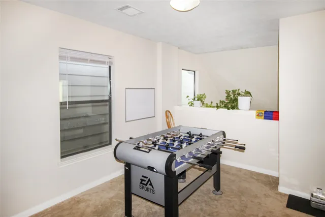 a patio with table and chairs