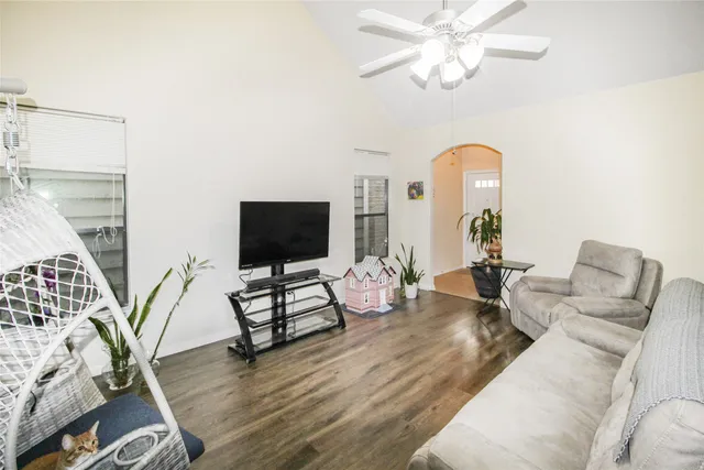 a living room with furniture and a large window