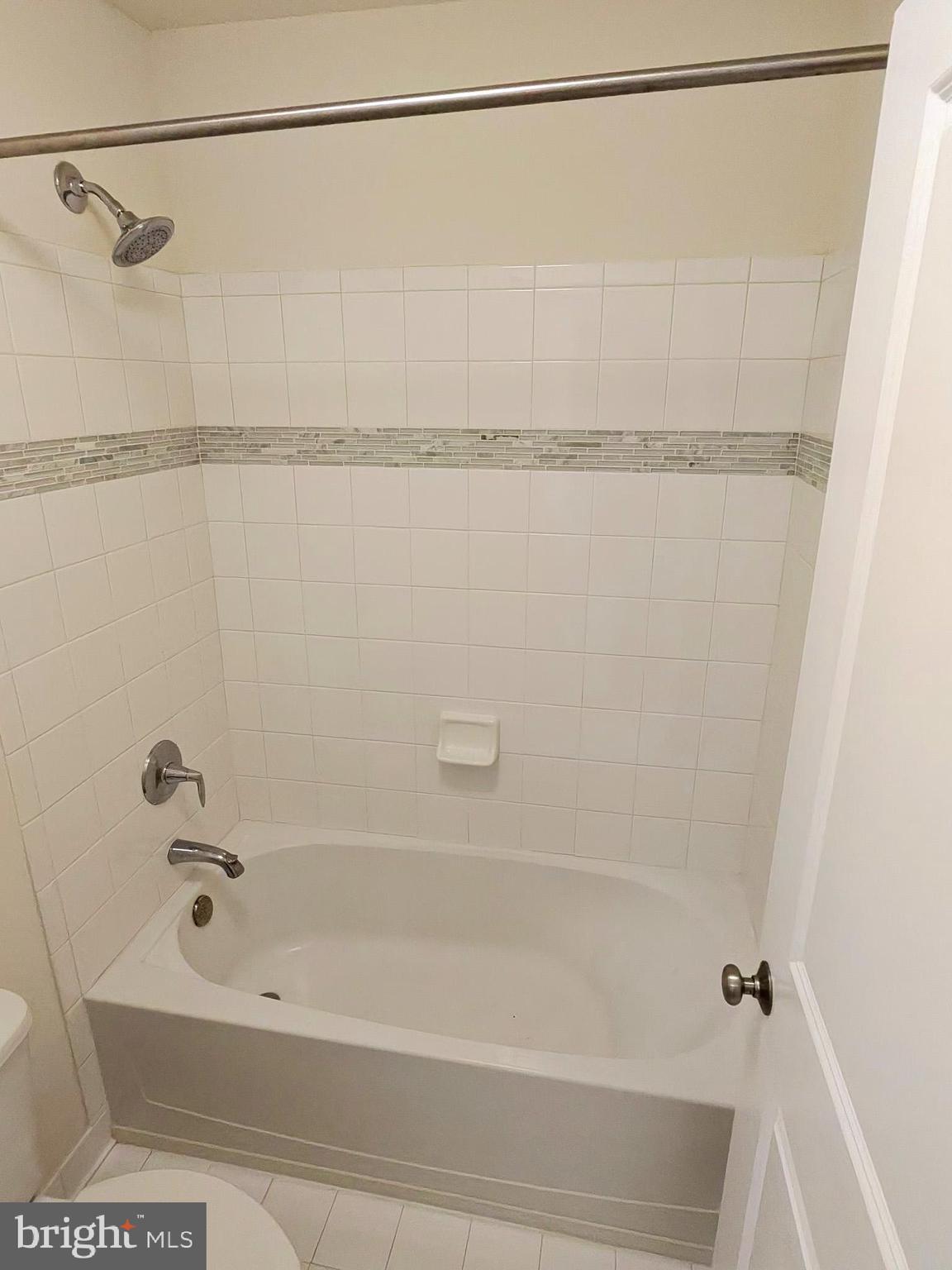 5707 Iron Stone Road Lothian, MD 20711 - Photo 6 of 90 a bathroom with a shower and a shower