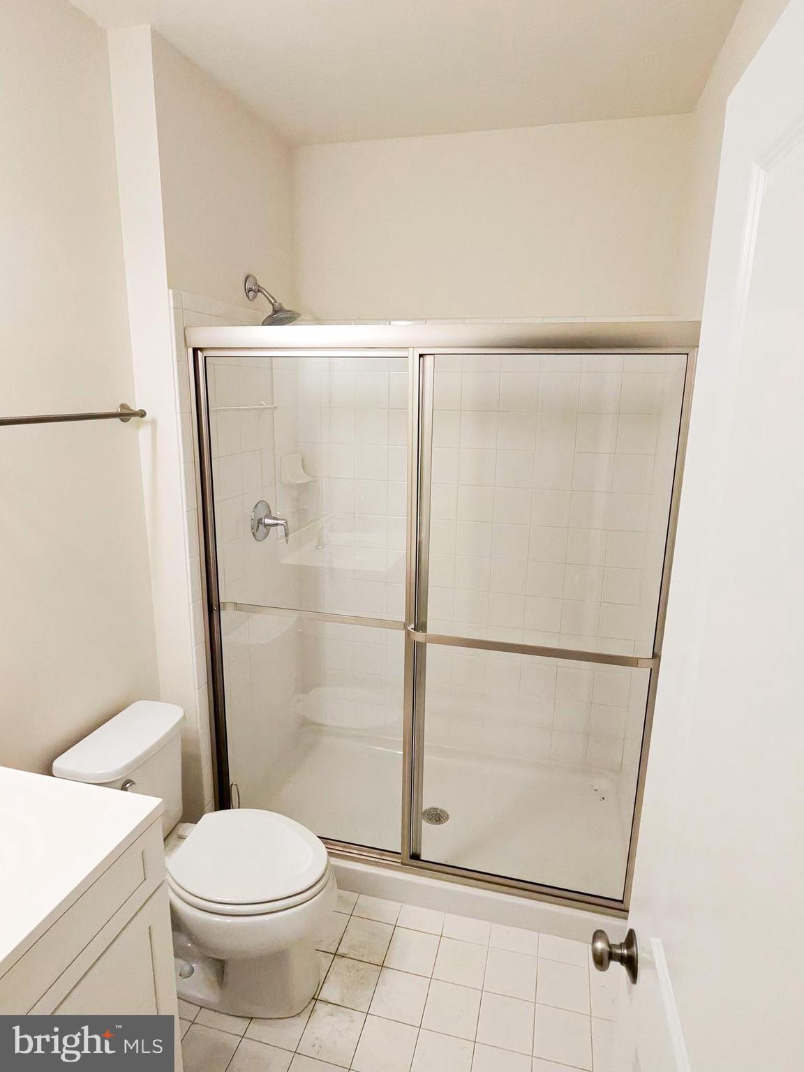 5707 Iron Stone Road Lothian, MD 20711 - Photo 8 of 90 a bathroom with a toilet and a shower