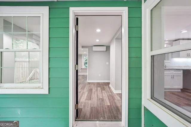a view of backyard with deck and wooden floor