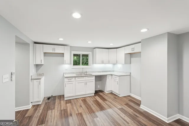 a view of backyard with deck and wooden floor
