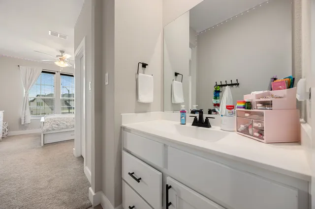 a room with a sink and a mirror