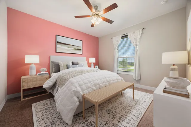 a bed room with a bed and a lamp