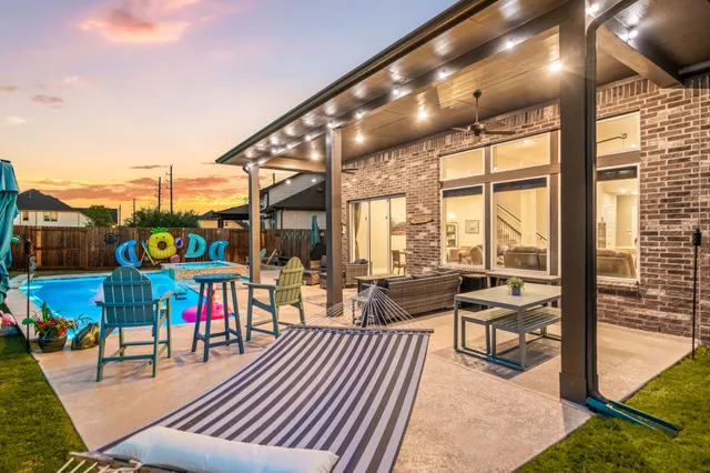 a view of an outdoor dining space with furniture from the balcony