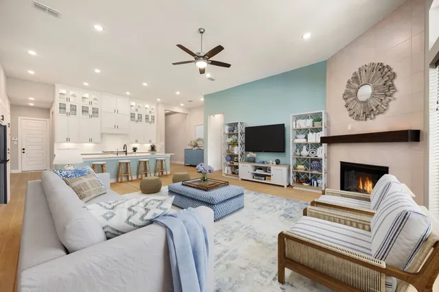 a living room with fireplace furniture and a flat screen tv