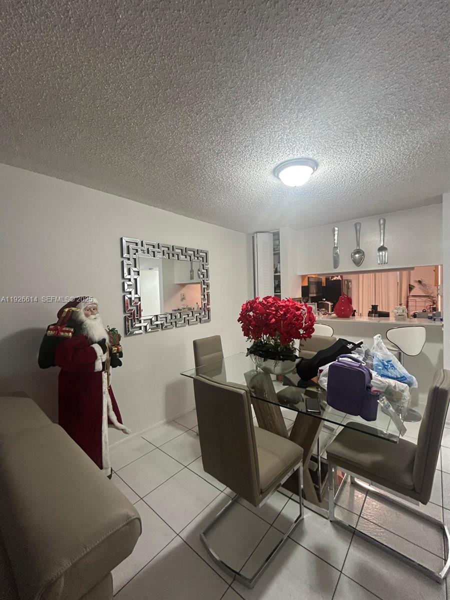 19771 Southwest 114th Avenue, Unit 329 Miami, FL 33157 - Photo 5 of 12 a workspace with furniture and a window