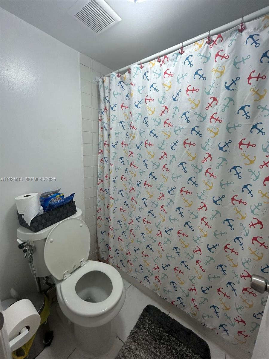 19771 Southwest 114th Avenue, Unit 329 Miami, FL 33157 - Photo 10 of 12 a bathroom with a toilet and a sink