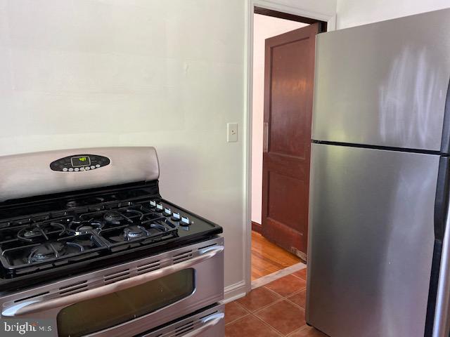 202 East Spring Street Alexandria, VA 22301 - Photo 11 of 45 a kitchen with a refrigerator and a stove