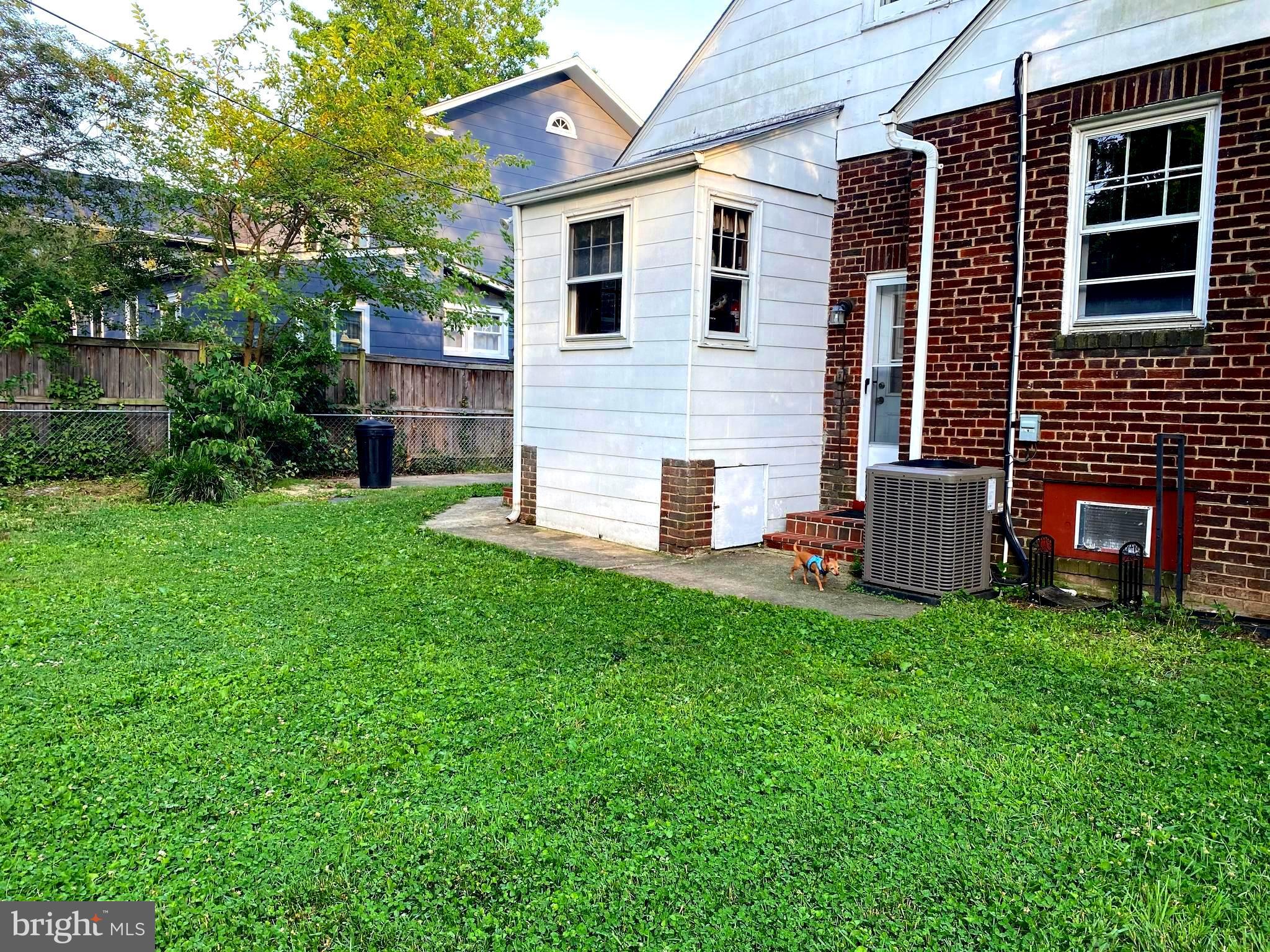 202 East Spring Street Alexandria, VA 22301 - Photo 4 of 45 a view of a house with a yard